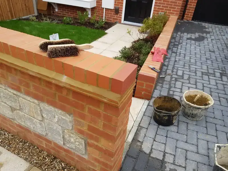 New small front Garden wall of orange brickwork, Wall at front and side of the garden.
